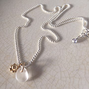 Delicate seaglass droplet & tiny gold flower on silver chain